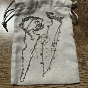 2 Kendra Scott silver necklaces.